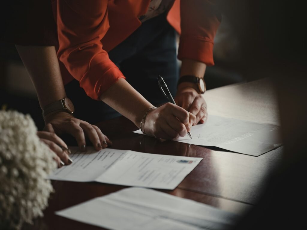 Person reviewing an employment contract at a desk