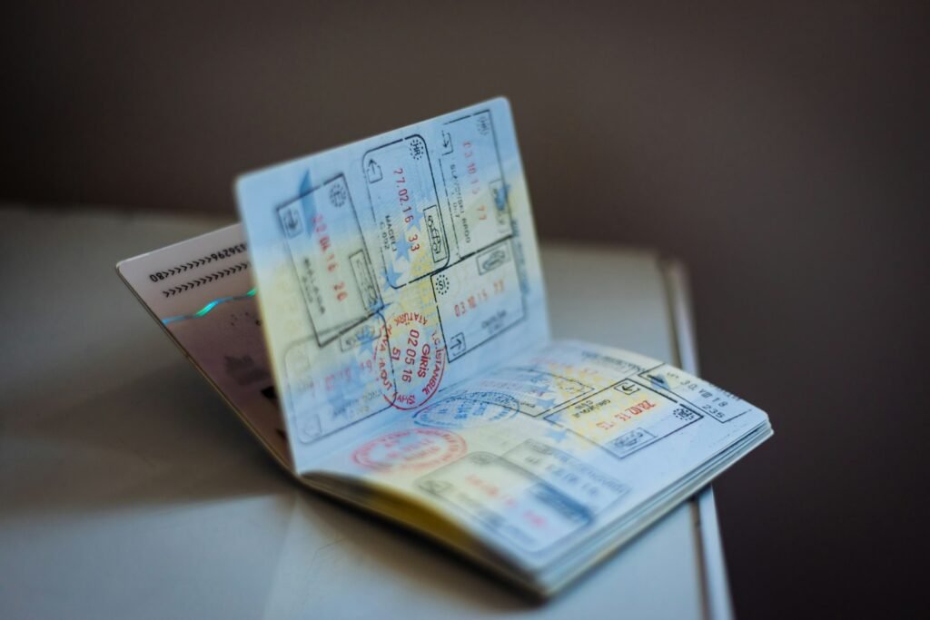 Passport and work visa paperwork on a desk