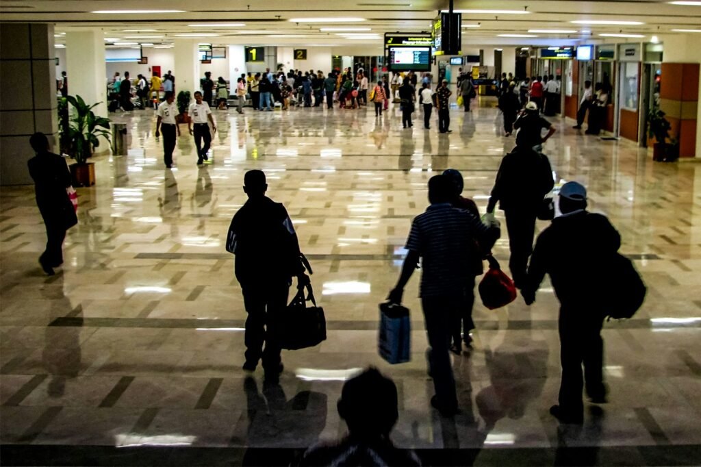 Traveler holding a passport at a U.S. airport