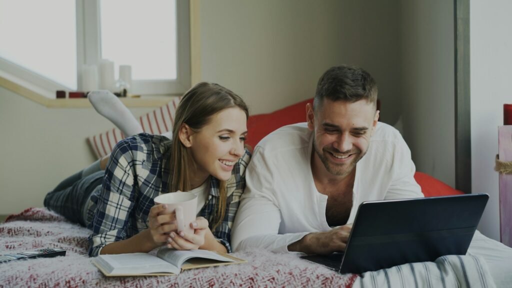 Couple reviewing paperwork together at home