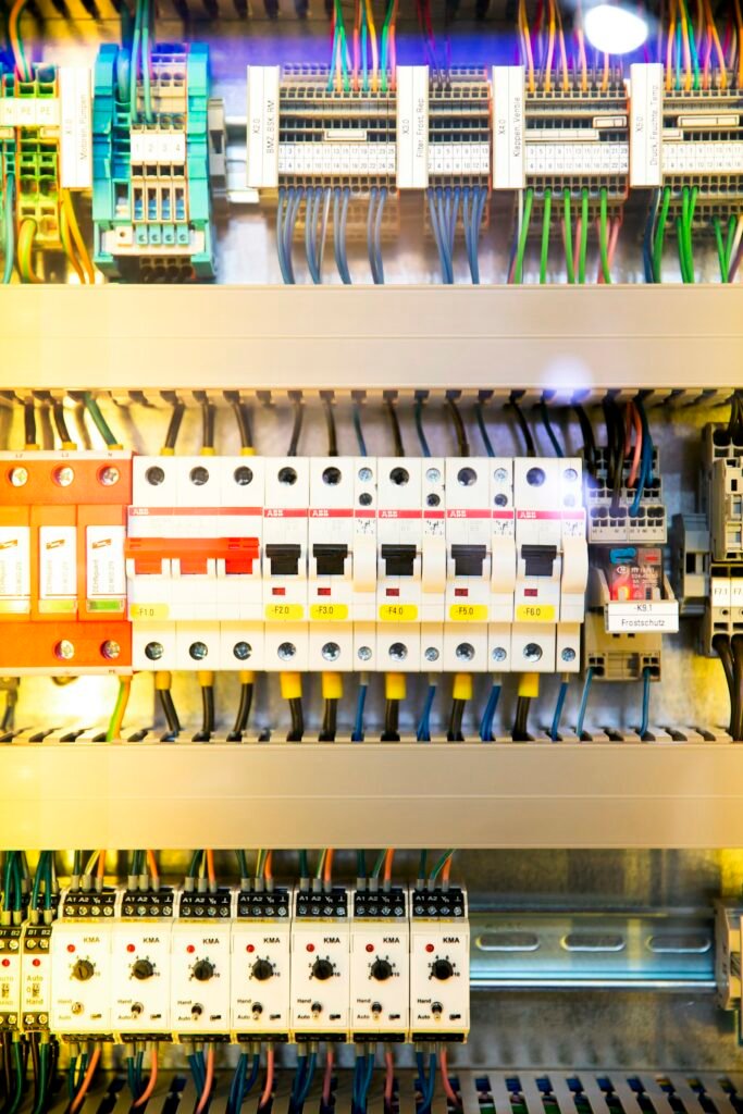 Electrician working at an electrical panel