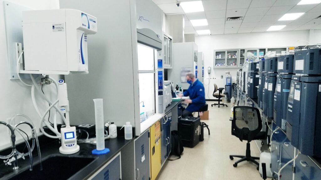 Engineer reviewing technical work in a lab