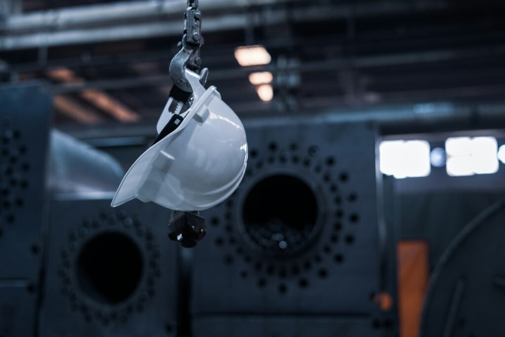 Safety worker in a hard hat inspecting an industrial plant