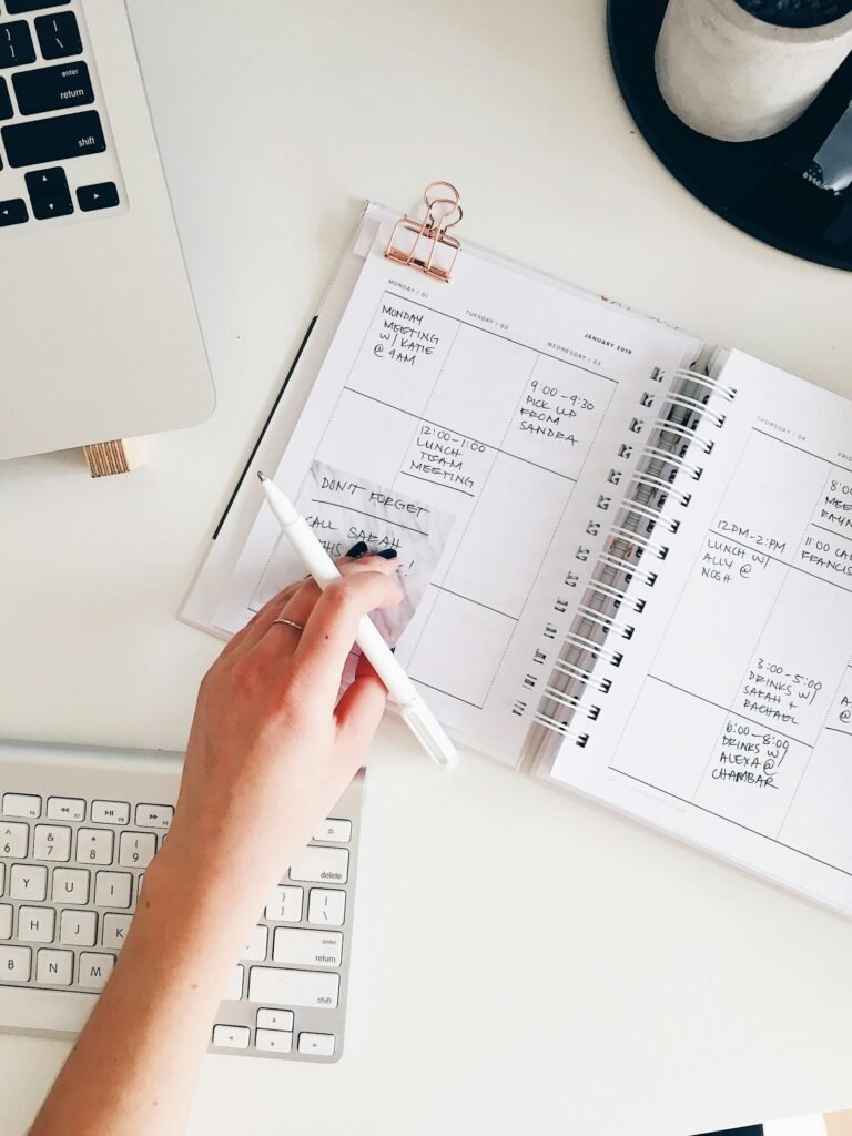 Calendar and paperwork on a desk for tracking dates