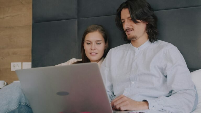 Couple working together on a laptop