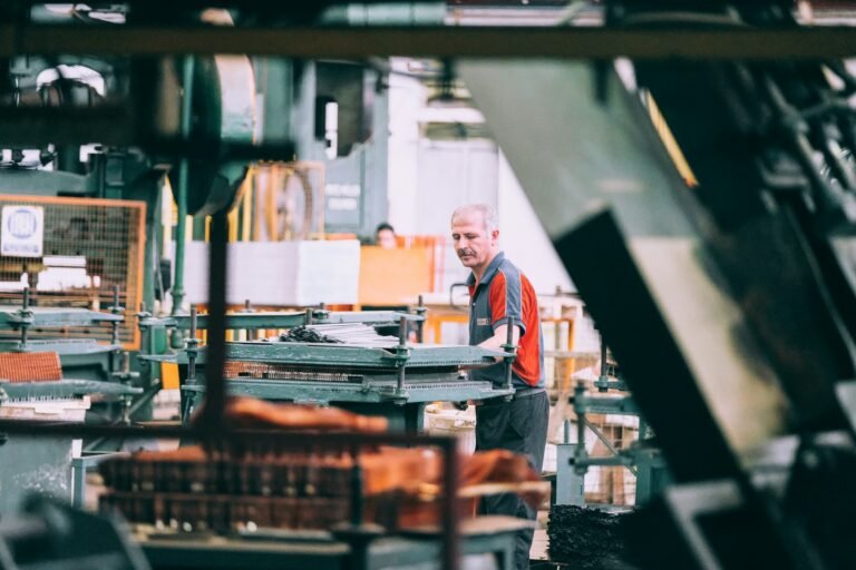 Technician operating industrial machinery