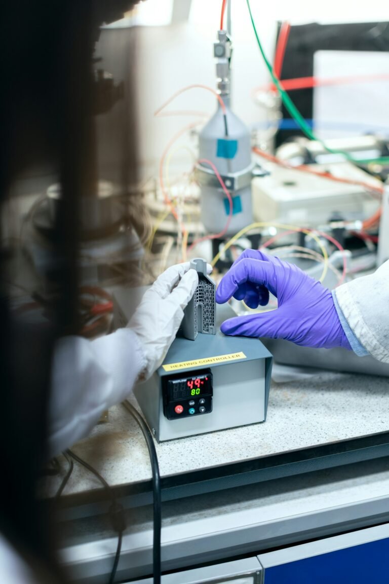 Engineer in gloves working on electronics