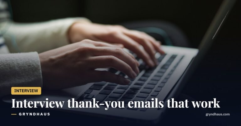 Hands typing an email on a laptop